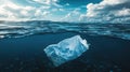 Plastic bag floating underwater, illustrating ocean pollution Royalty Free Stock Photo