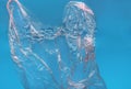 Plastic bag floating on water surface, top view Royalty Free Stock Photo