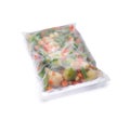Plastic bag with frozen vegetables on white background Royalty Free Stock Photo