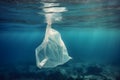 Plastic bag in the ocean. Waste underwater in the Mediterranean sea between water surface and a seabed. Earth safe and ecology