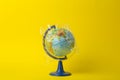 Plastic bag pollution concept. Earth globe in a plastic bag on a colored background. Plastic and waste pollution oceans, nature Royalty Free Stock Photo