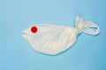 A plastic bag in the shape of a sea fish on a blue background. Plastic pollution ocean and sea concept. Creative, minimal concept Royalty Free Stock Photo