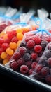 Plastic bags of frozen berries displayed tidily on a supermarkets cold shelf