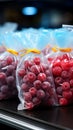 Plastic bags of frozen berries displayed tidily on a supermarkets cold shelf