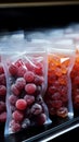Plastic bags of frozen berries displayed tidily on a supermarkets cold shelf