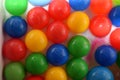 Plastic balls of different colors in bubble bath Royalty Free Stock Photo