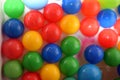Plastic balls of different colors in bubble bath Royalty Free Stock Photo