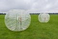 Plastic balls for soccer playing, on a lawn