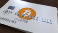 Plastic bank card with bitcoin logo. New ways of cryptocurrency payments conceptual 3D rendering