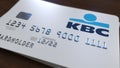 Plastic card with logo of KBC Bank. Editorial conceptual 3D rendering