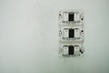 Plastic bare switch stick on white wall in room. this image for Royalty Free Stock Photo