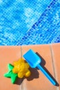 Plastic beach toys near pool Royalty Free Stock Photo