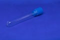 Plastic blood collection tube with blue cap. The photo has a blue background