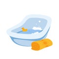 Plastic blue tub for bathing newborn, cute floating rubber duck toy in bath with water