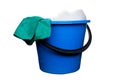 Plastic blue water bucket with soapsuds and black handle and green rag