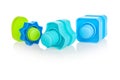 Plastic bolts and nuts in blue, green, various shapes, for children, isolated on a white background