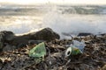 Plastic bottle and aluminum waste on ocean sea coast,environmental debris pollution