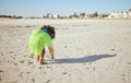 Plastic bottle, beach and child recycling for ocean, earth day or climate change education, learning and volunteer Royalty Free Stock Photo