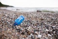 Plastic bottle is on the beach leave by tourist. Ecology, garbage, environmental pollution