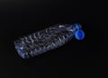 Plastic bottle on black bacgrounds Royalty Free Stock Photo
