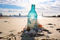 a plastic bottle broken down into microplastics on a sandy beach
