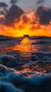 Plastic bottle floating in ocean at sunset, environmental pollution concept Royalty Free Stock Photo