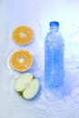Plastic bottle with fruit Royalty Free Stock Photo