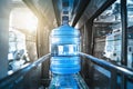 Plastic bottle or gallon of purified drinking water inside automated conveyor production line. Water factory Royalty Free Stock Photo