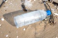Plastic bottle or garbage on the sand beach. Royalty Free Stock Photo