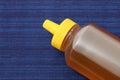 Plastic bottle of honey on table Royalty Free Stock Photo
