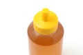 Plastic bottle of honey on white Royalty Free Stock Photo