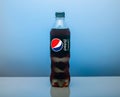 Plastic bottle of Pepsi Cola MAX 0.5 liters on a blue background. Zero calories Pepsi soft drink bottle isolated on blue Royalty Free Stock Photo