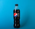 Plastic bottle of Pepsi Cola MAX 0.5 liters on a blue background. Zero calories Pepsi soft drink bottle isolated on blue Royalty Free Stock Photo
