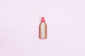 Plastic Bottle pomp with cosmetic liquid, soap or shampoo, gel. On a pink background. With clipping path. flatlay Royalty Free Stock Photo