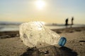 Plastic bottle on sea shore, Garbage caused by our negligence Royalty Free Stock Photo