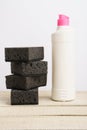 Plastic bottle and washcloths on a white background