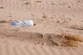 Plastic bottle washed up on a beach. Royalty Free Stock Photo