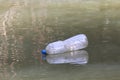 Plastic Bottle Waste On the water surface dirty, Rotten water, Bottle Waste Royalty Free Stock Photo
