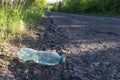 Plastic bottle with water by the road