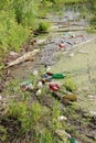 Plastic bottles of beer and lemonade thrown into the pond. garbage, waste, environmental pollution