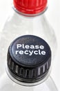 Plastic bottles and bottle caps with please recycle Royalty Free Stock Photo