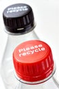 Plastic bottles and bottle caps with please recycle Royalty Free Stock Photo