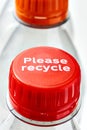 Plastic bottles and bottle caps with please recycle Royalty Free Stock Photo
