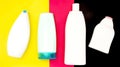 Plastic bottles for cosmetics on colored paper background. cosmetic set. Top view. Shampoo, shower gel, soap. template.