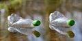 Plastic bottles floating in puddle of water. Pollution garbage in forest. Royalty Free Stock Photo