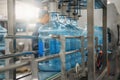 Plastic bottles or gallons on automated conveyor production line. Water factory Royalty Free Stock Photo