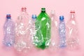 Plastic bottles on pink pastel background top view. Eco plastic recycling Royalty Free Stock Photo