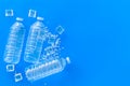 Plastic bottles with pure water and ice on blue background top view space for text Royalty Free Stock Photo