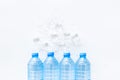 Plastic bottles with pure water and ice on white background top view space for text Royalty Free Stock Photo