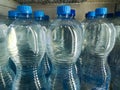 Plastic bottles with purified drinking water on shelf in fridge put up for sale shop Royalty Free Stock Photo